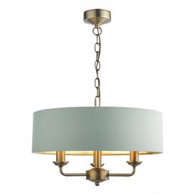 Hanging 3 Light Shadelier in Matt Antique Brass with Green shade with metallic silver inner